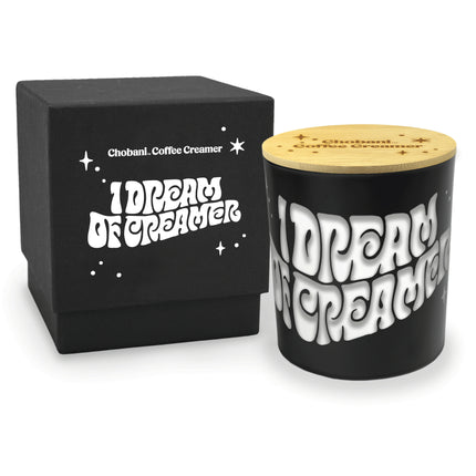 Close-up view of 14 oz black luxury candle showing engraved personalization detail and an accompanying engraved lid