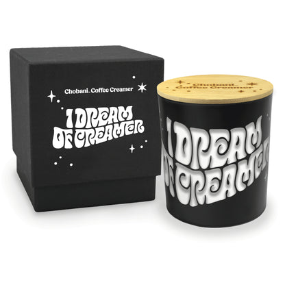 Close-up view of 14 oz black luxury candle showing engraved personalization detail and an accompanying engraved lid