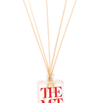 2 oz mini reed diffuser with clear glass bottle and reeds inserted, featuring custom logo branding