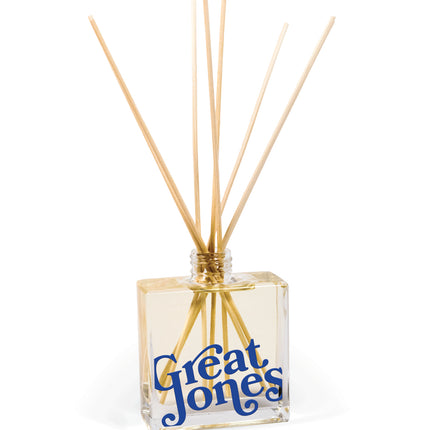 8 oz clear glass reed diffuser bottle displaying custom logo imprint with natural reeds, elegant promotional product for corporate branding