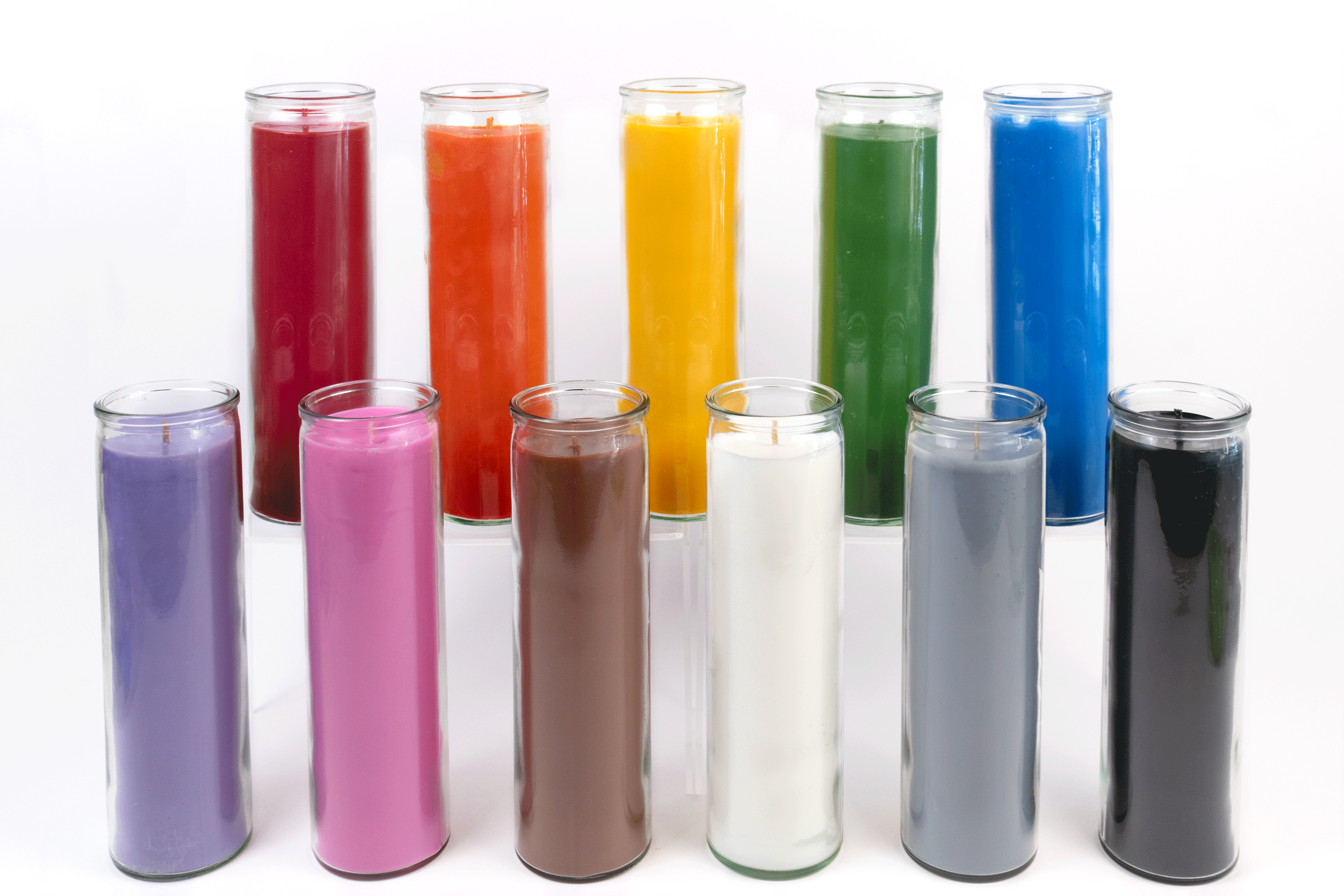 An assortment of 16 oz. 7-day Custom Prayer Candles from Custom Candles L.A. Each candle is a different color. From left to right on the top row the order is: Red, orange, yellow, green blue. From left to right on the bottom row the order is: purple, pink, brown, white, gray, black. Each candle is tall and slender with clear glass.