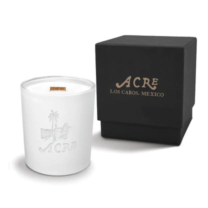 Luxury engraved candle with branding next to a box on a white background