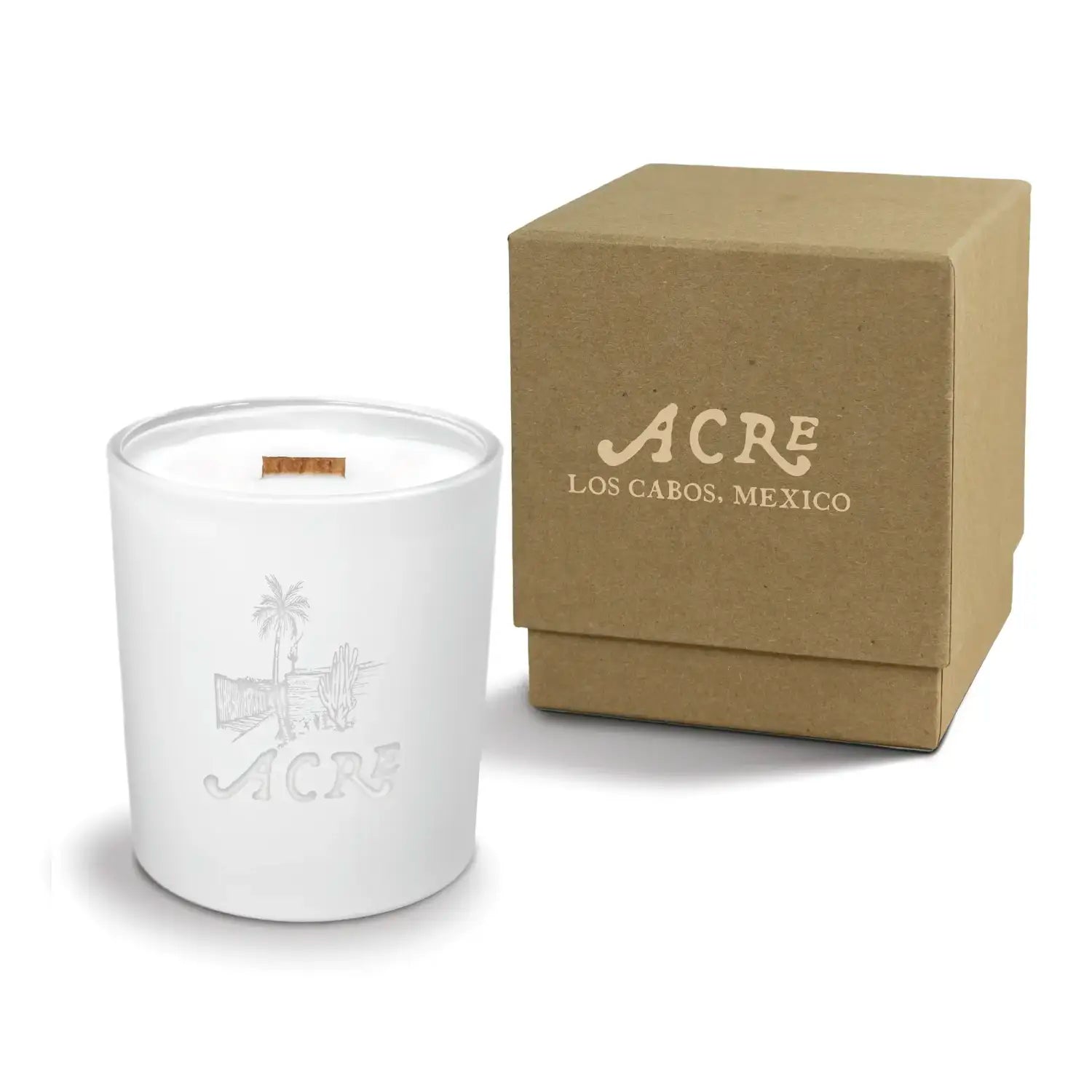 Luxury engraved candle with branding next to a box on a white background
