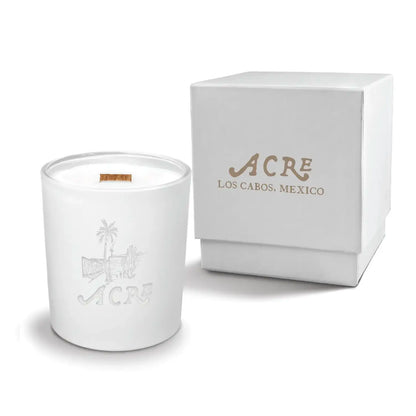 Luxury engraved candle with branding next to a box on a white background