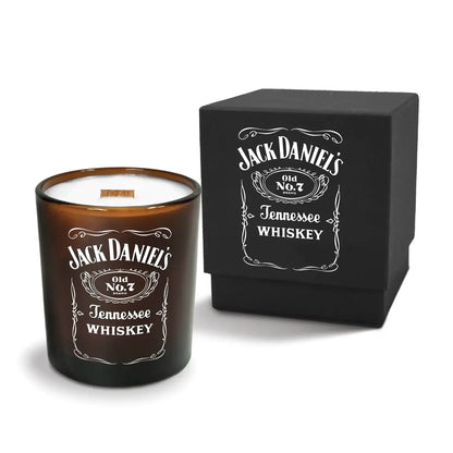 Luxury engraved candle with branding next to a box on a white background