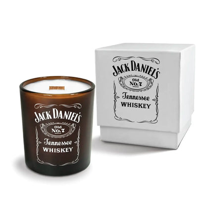 Luxury engraved candle with branding next to a box on a white background