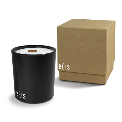 Luxury engraved candle with branding next to a box on a white background
