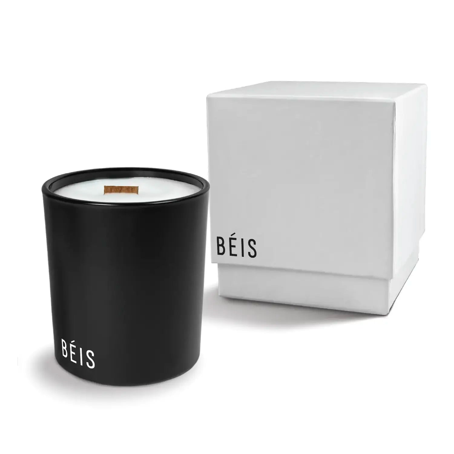 Luxury engraved candle with branding next to a box on a white background