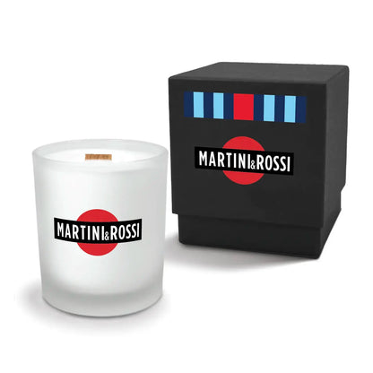 Luxury engraved candle with branding next to a box on a white background