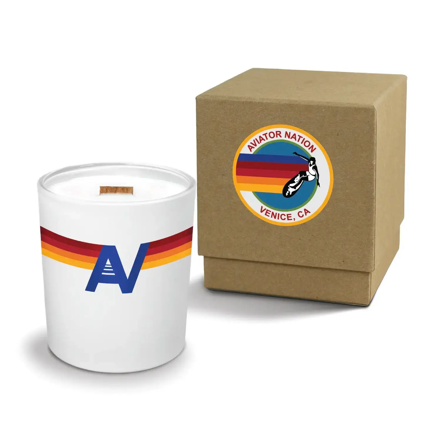 Luxury engraved candle with branding next to a box on a white background