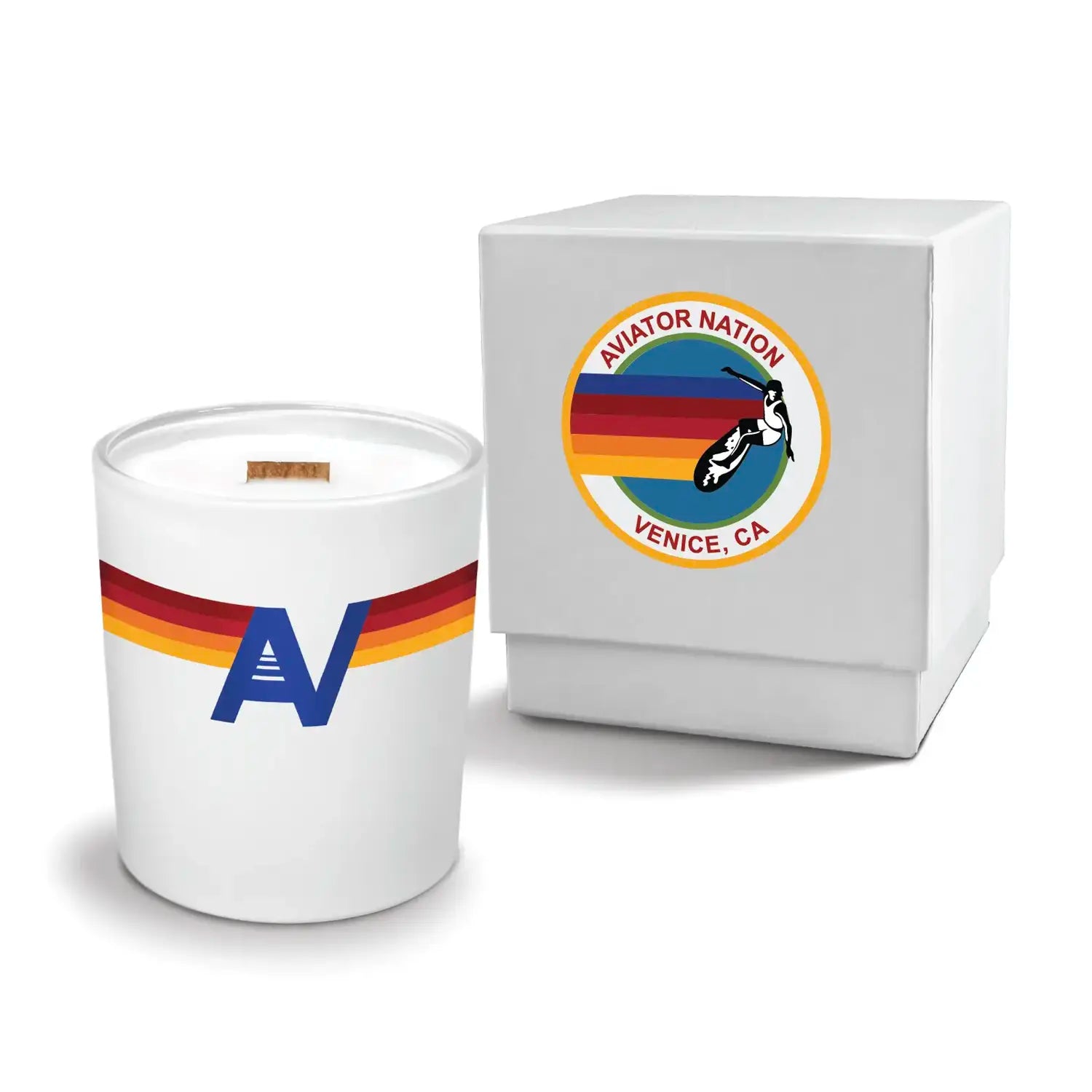 Luxury engraved candle with branding next to a box on a white background