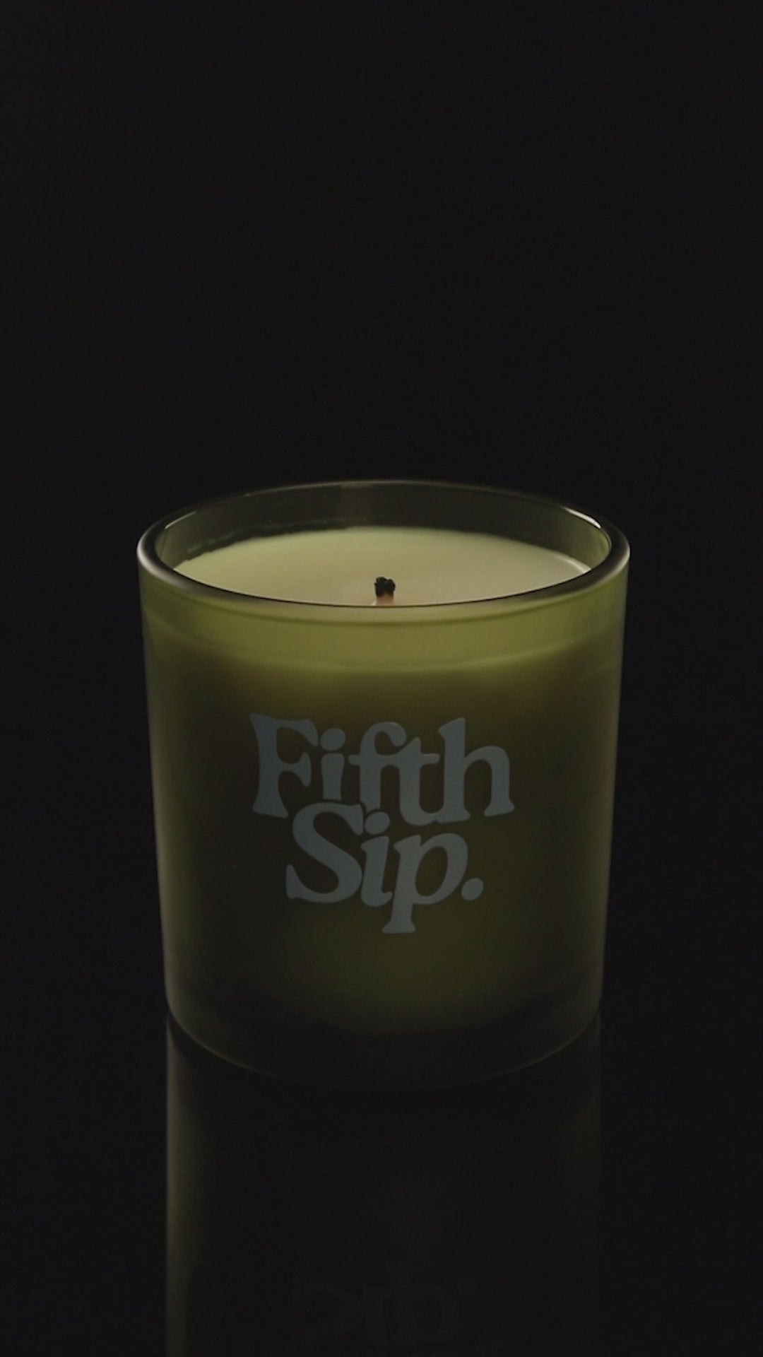 Green 9 oz. Classic Printed Candle burning.