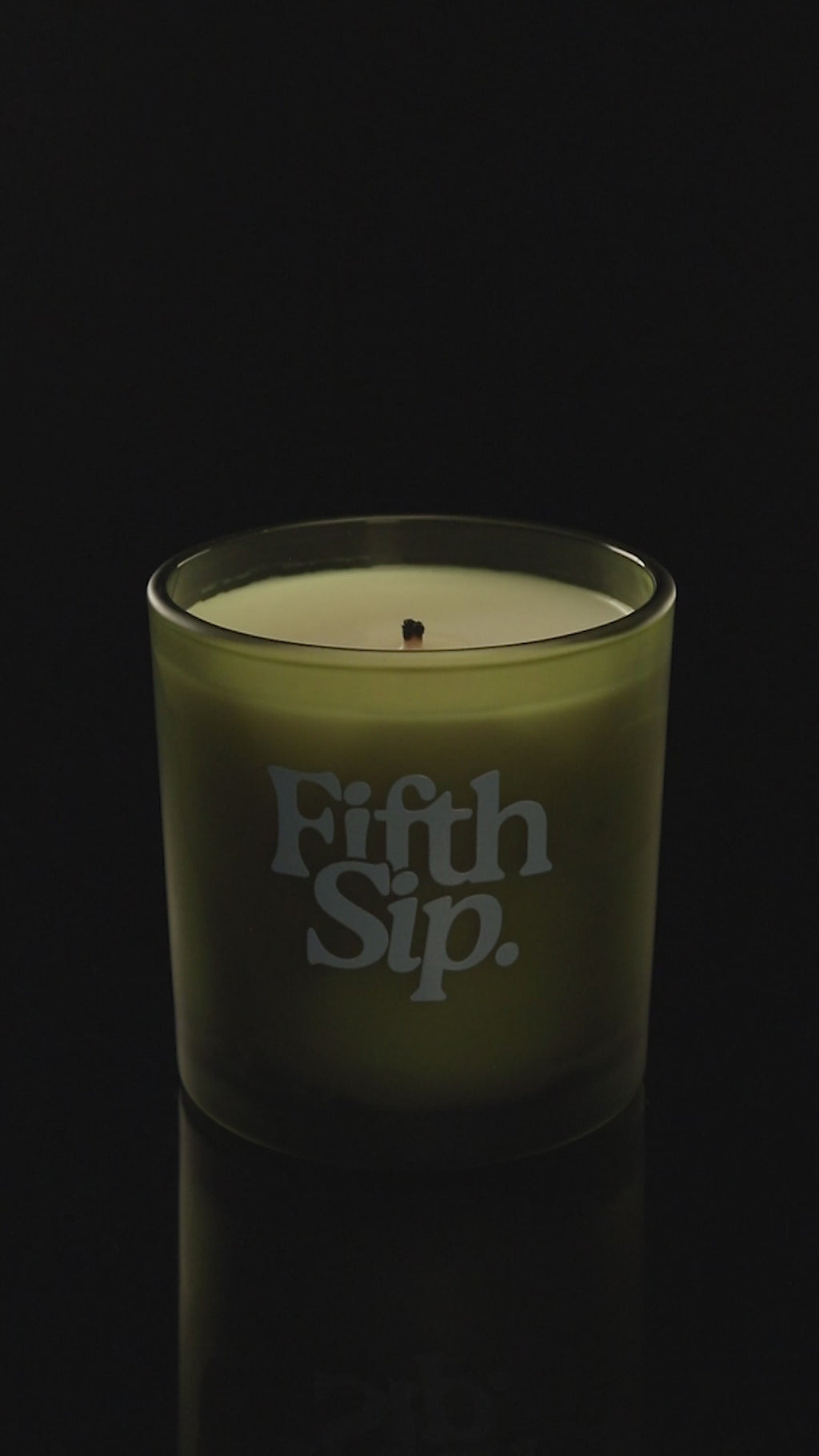 Green 9 oz. Classic Printed Candle burning.