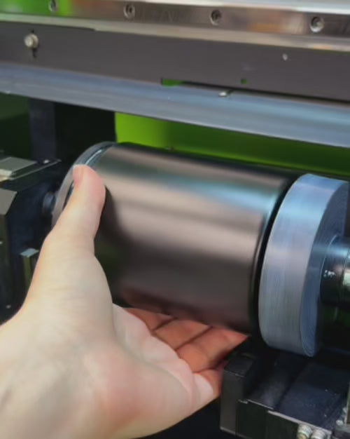 Load video: example of high speed rotational direct to surface printing process onto a black glass candle vessel