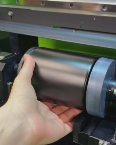 example of high speed rotational direct to surface printing process onto a black glass candle vessel