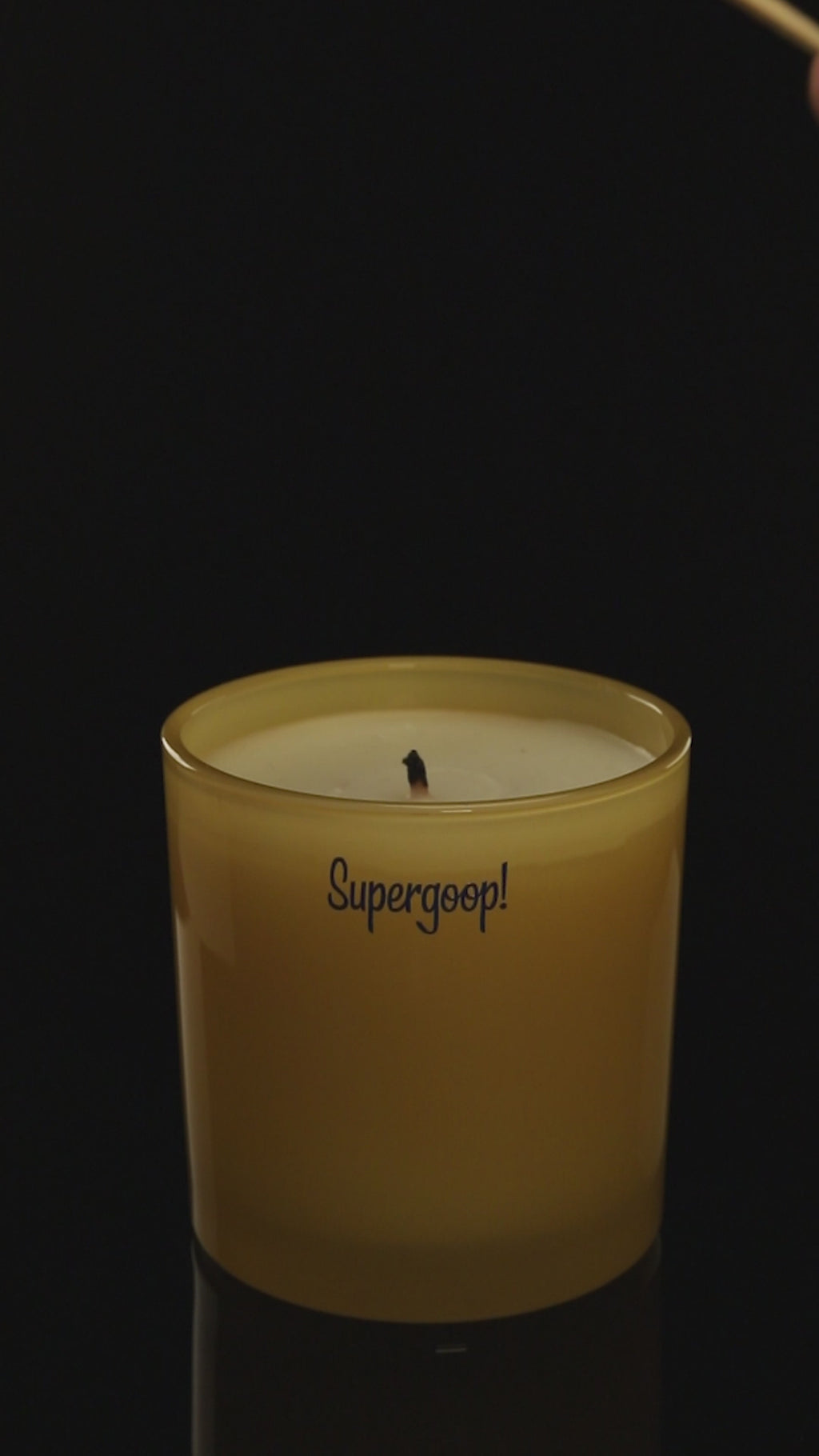 Yellow 9 oz. Classic Printed Candle burning.
