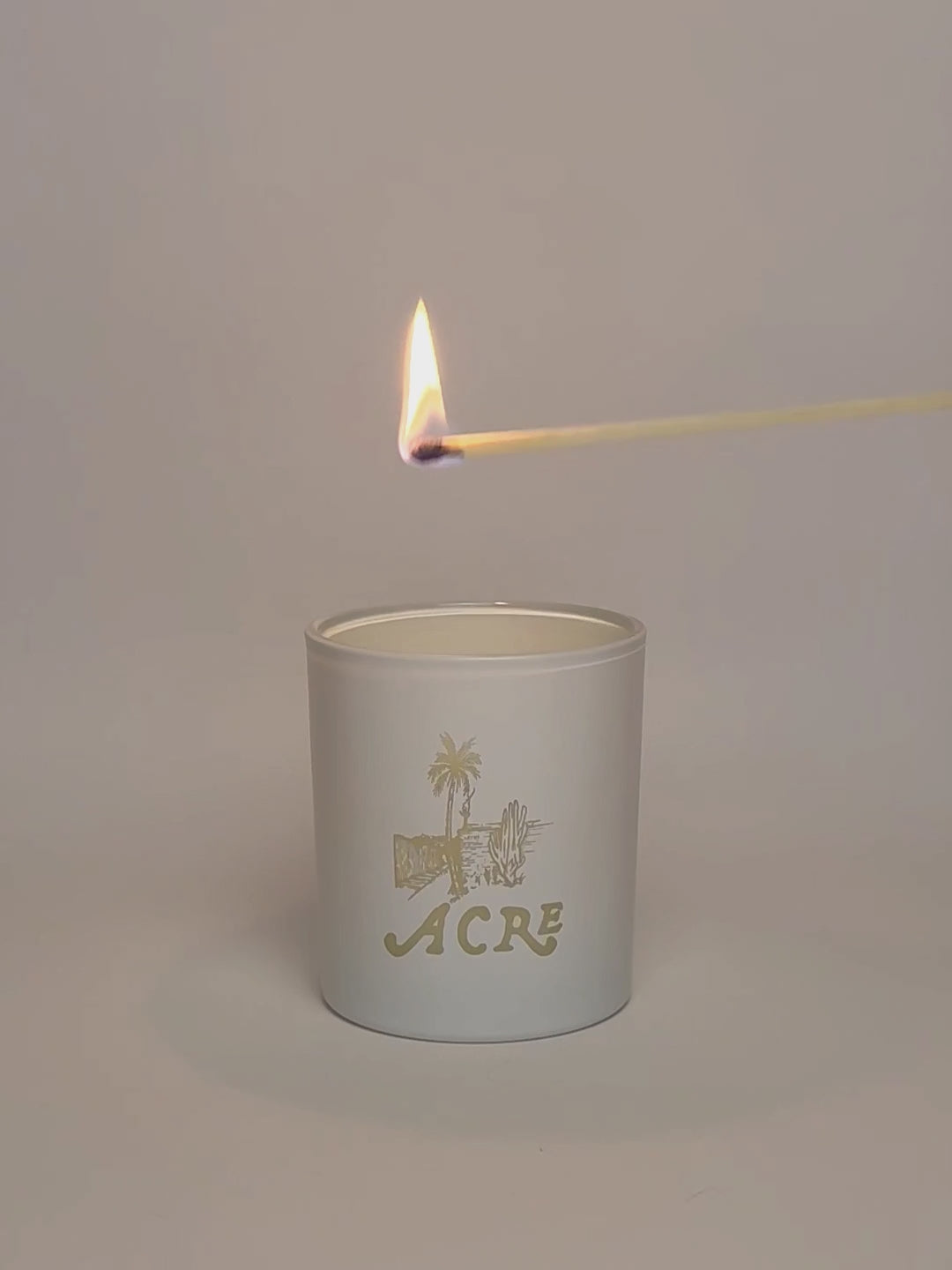 White Luxury Engraved Candle being lit product shot.