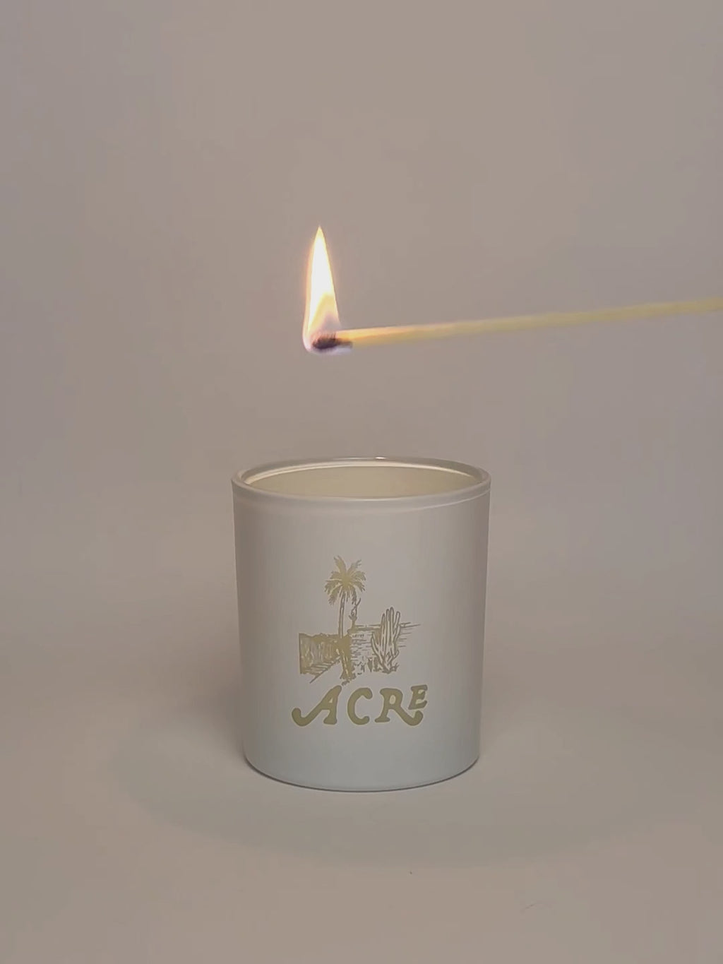 White Luxury Engraved Candle being lit product shot.