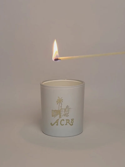 White Luxury Engraved Candle being lit product shot.