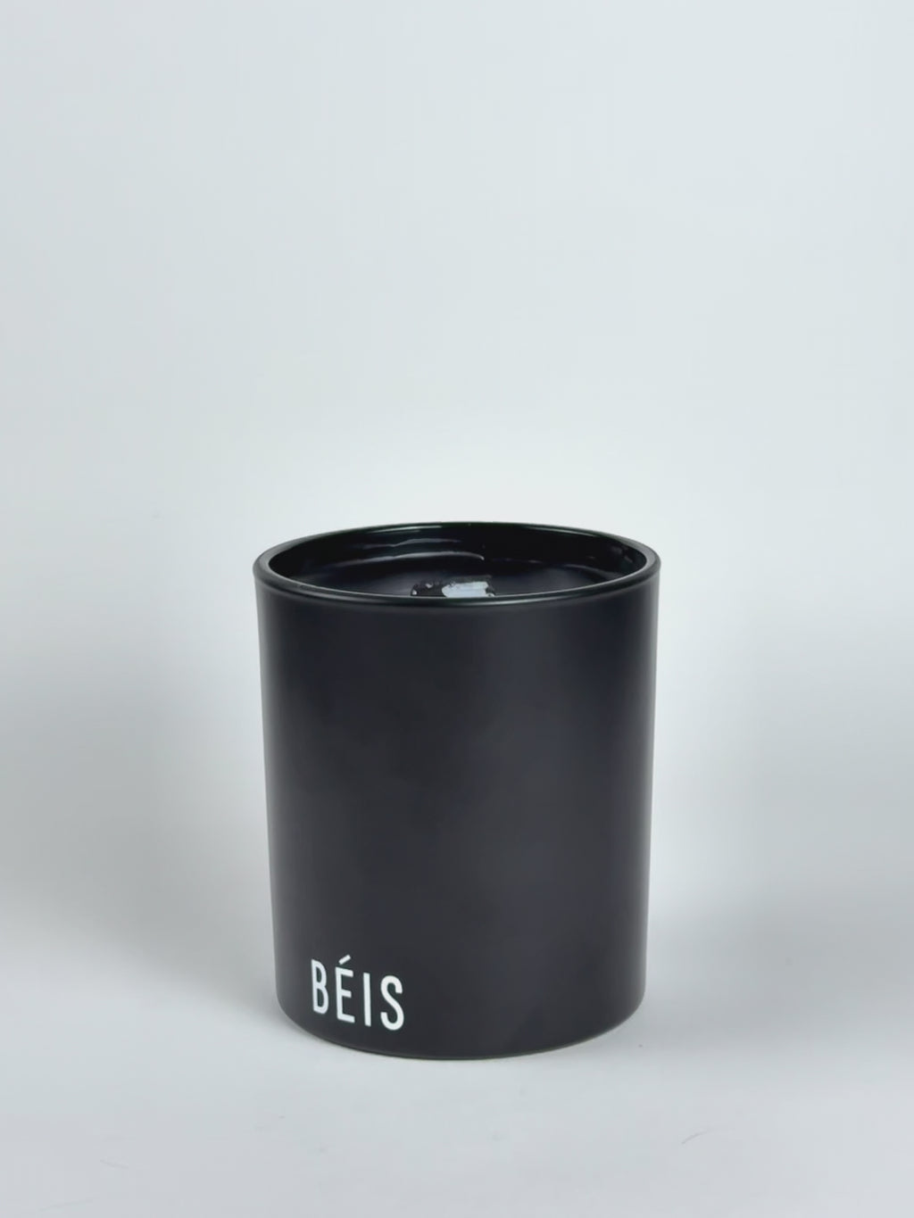 Black Luxury Printed Candle being lit product shot.