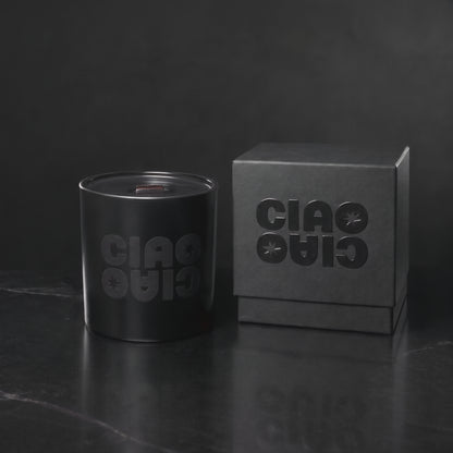 Matte Black 14 oz. Luxury Printed Candle with a tone-on-tone CIAO CIAO logo, lit.