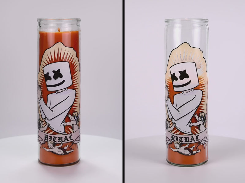 Two 16 oz Prayer Candles from Custom Candles LA filled with orange wax in a tall glass container spinning side by side. The candles are printed with an image of a person praying. The head of the person is marshmallow shaped with black Xs as eyes and a smile. Below the person there is a banner that reads "RITUAL" and the person is surrounded by three cherubs. There is a spikey border around the artwork and the orange wax shows through. 
