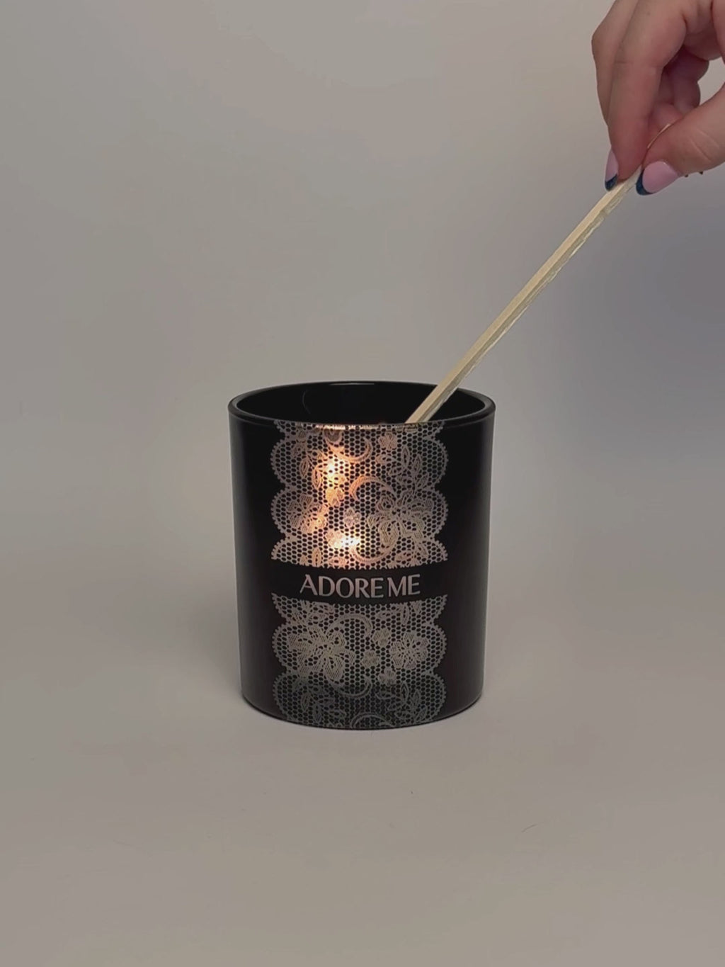 Black Luxury Engraved Candle being lit product shot.