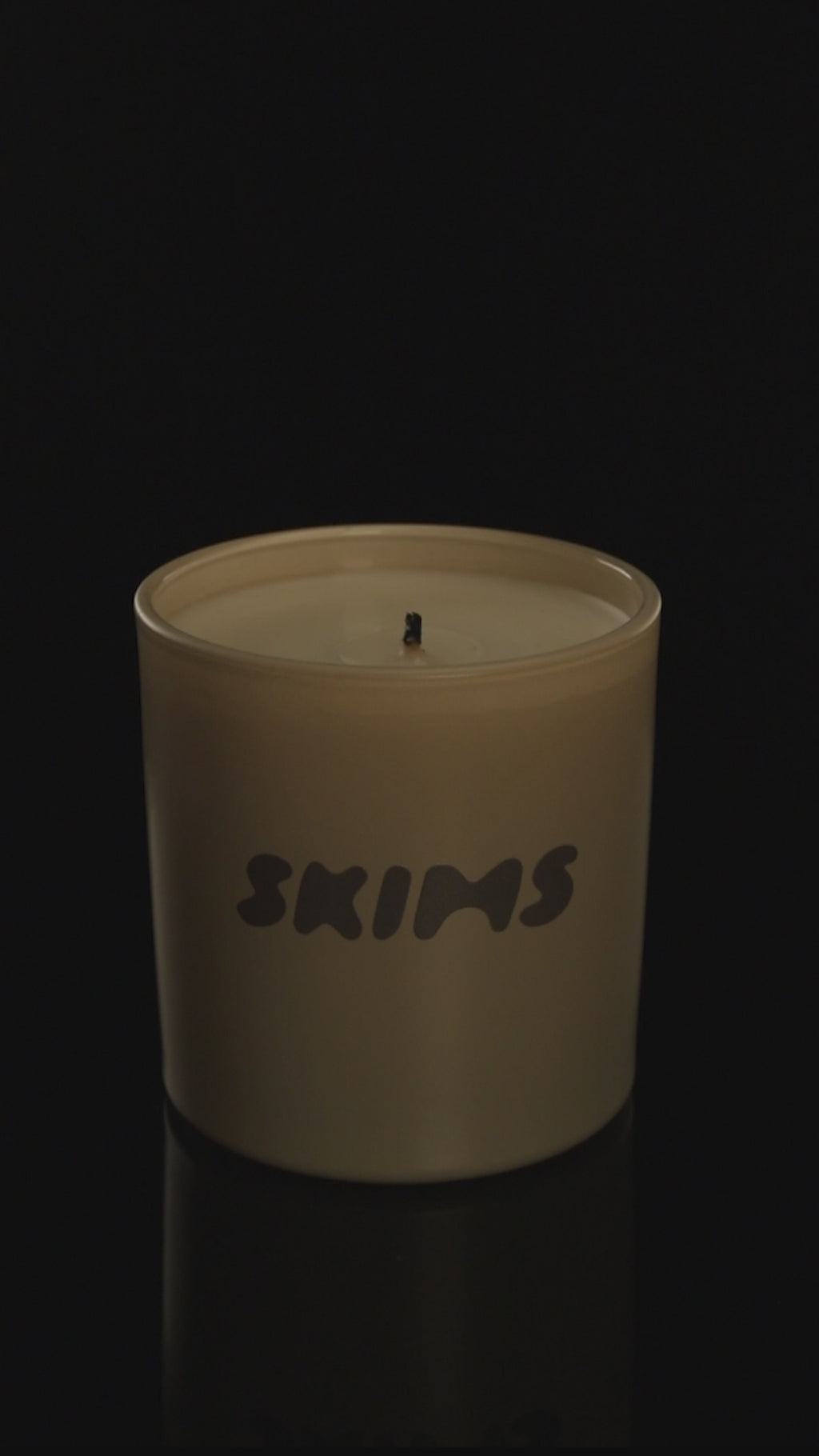 Nude 9 oz. Classic Printed Candle burning.