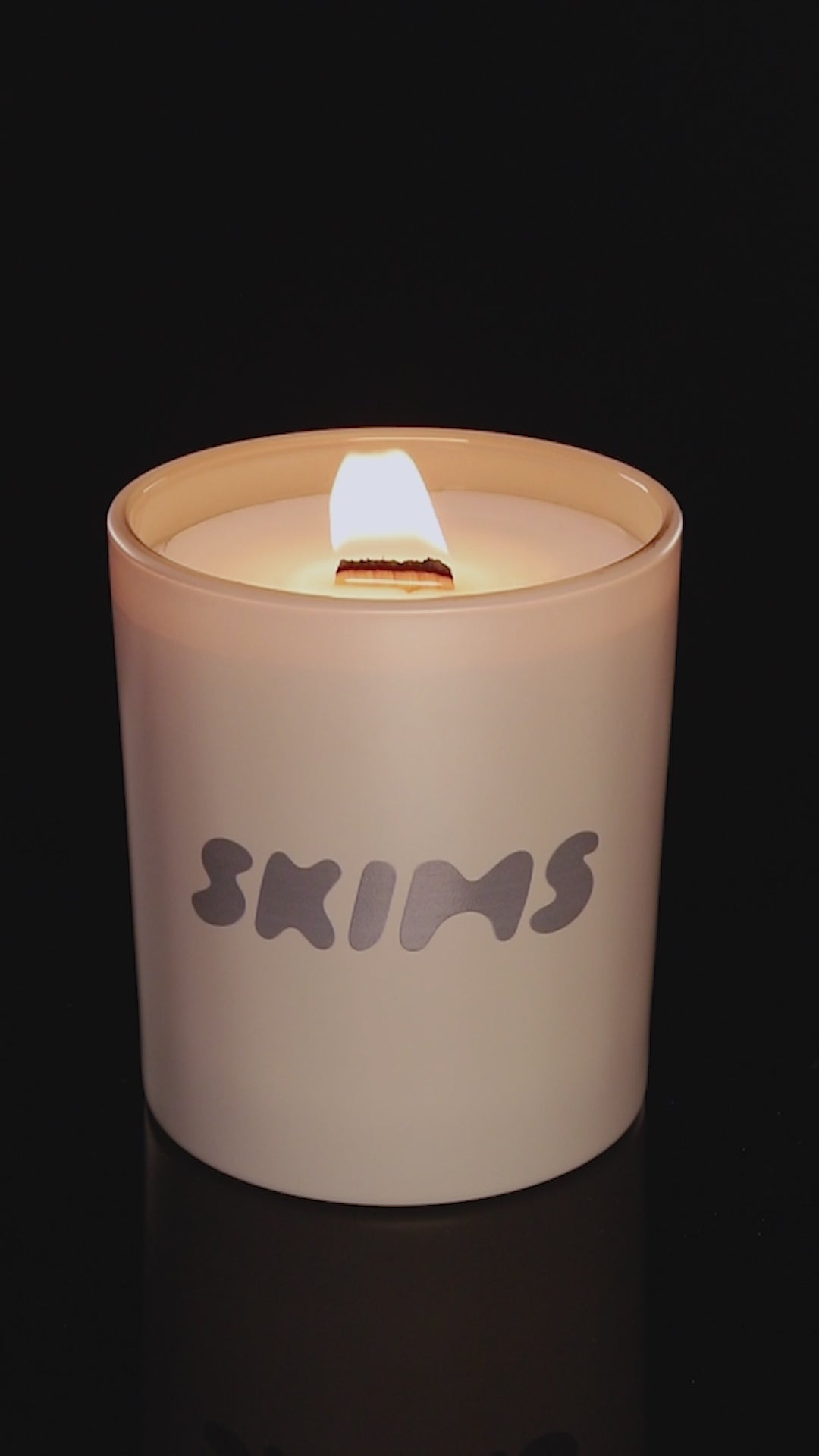 Nude 14 oz. Luxury Printed Candle burning.