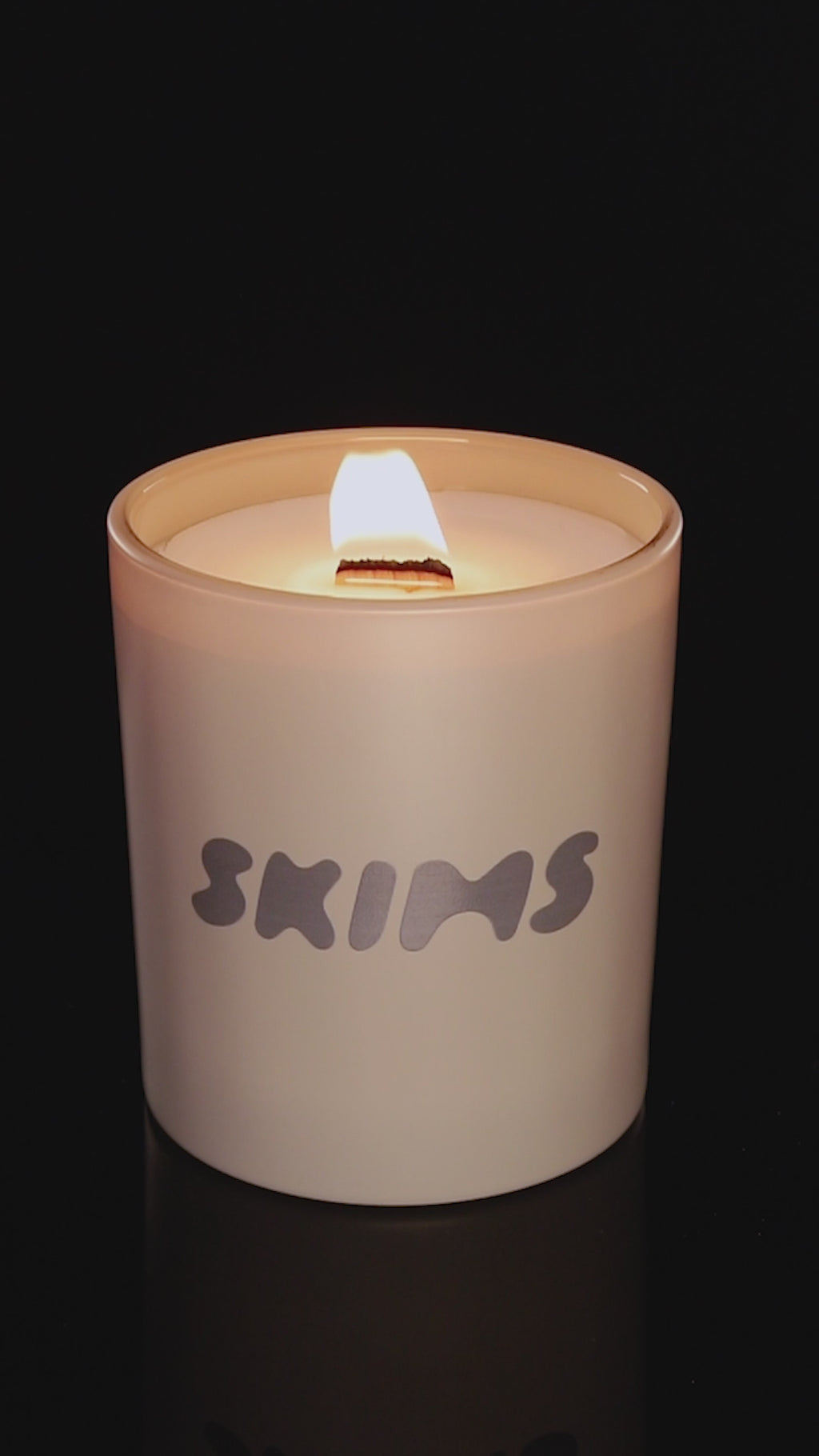 Nude 14 oz. Luxury Printed Candle burning.