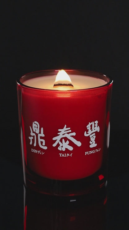 Red 14 oz. Luxury Printed Candle burning.