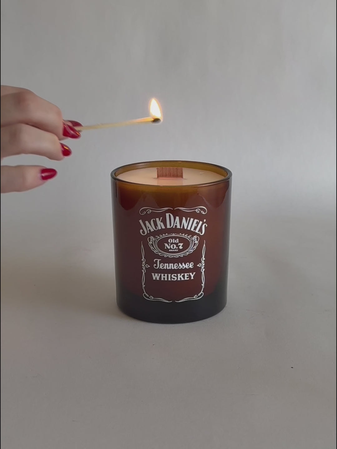 Amber Luxury Printed Candle being lit product shot.