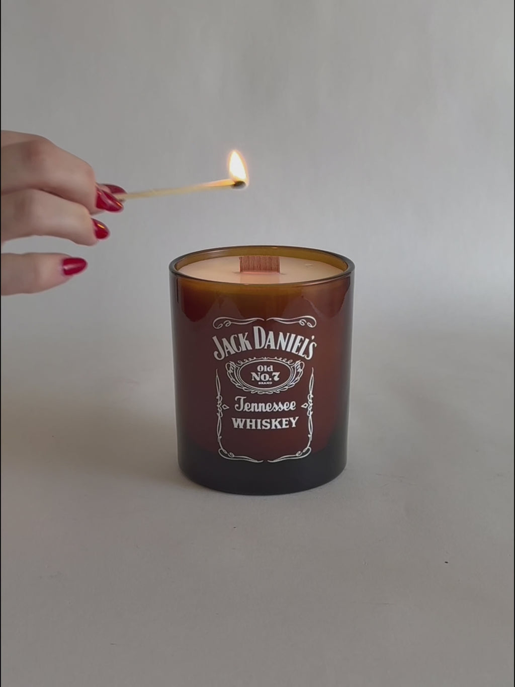 Amber Luxury Printed Candle being lit product shot.