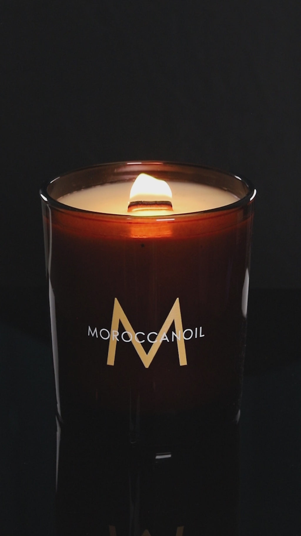 Glossy Amber 14 oz. Luxury Printed Candle burning.