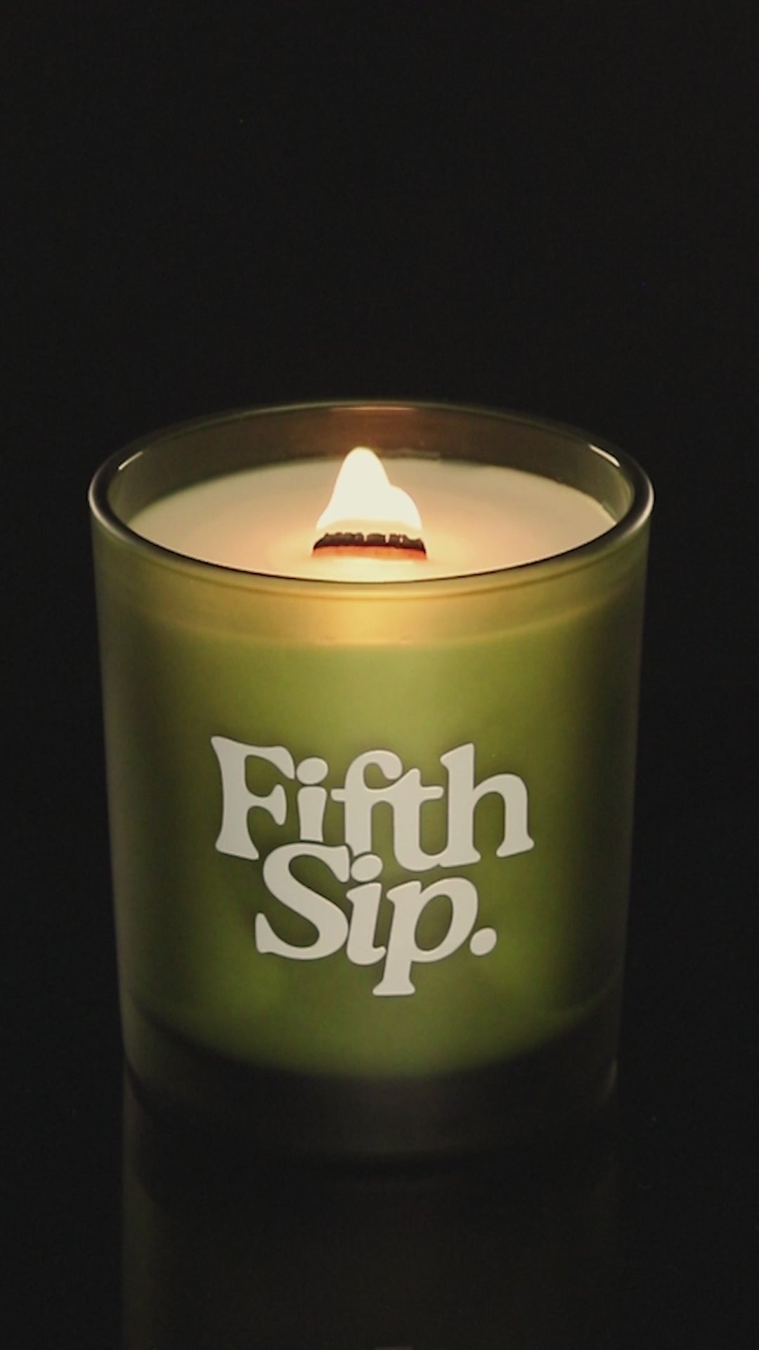 Green 14 oz. Luxury Printed Candle burning.