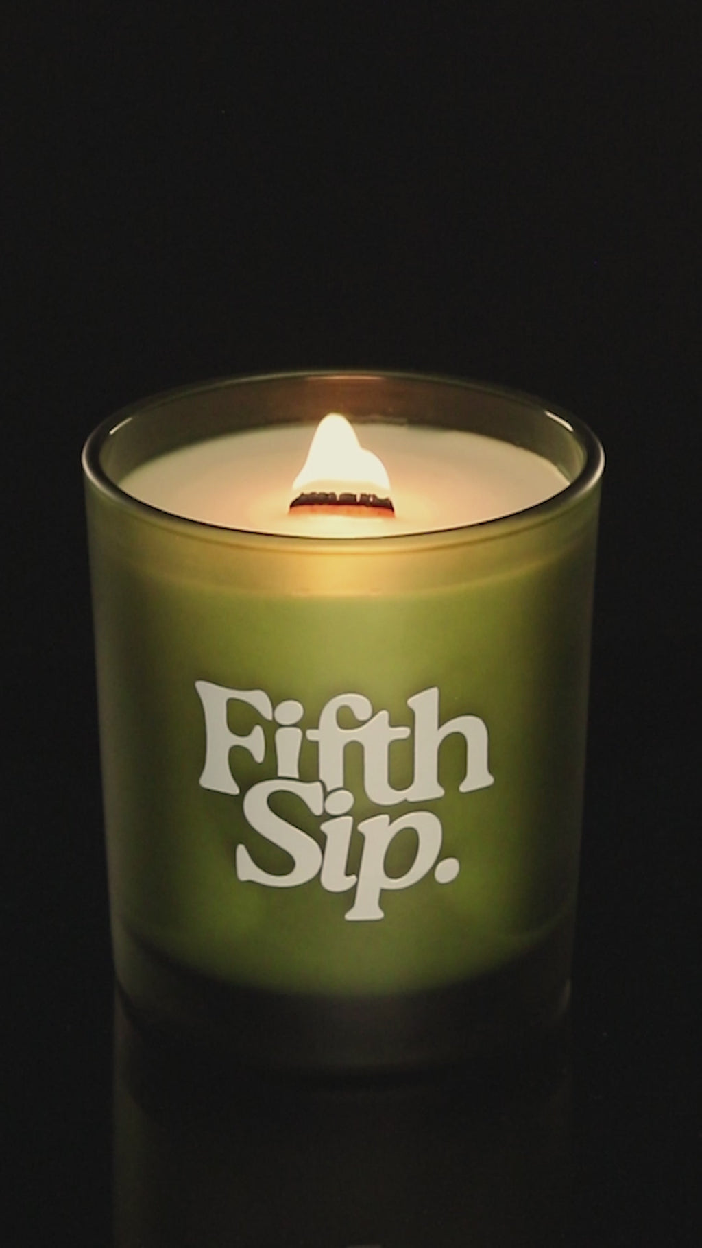 Green 14 oz. Luxury Printed Candle burning.