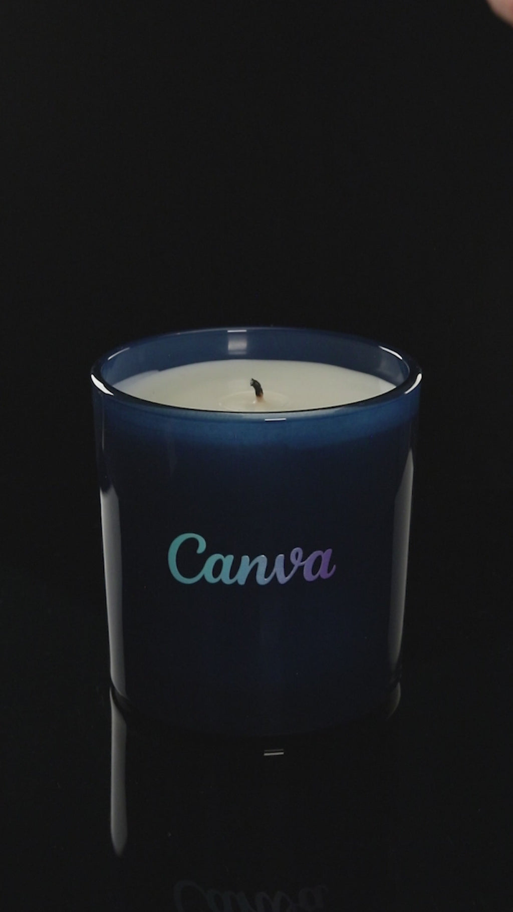 Blue 9 oz. Classic Printed Candle burning.